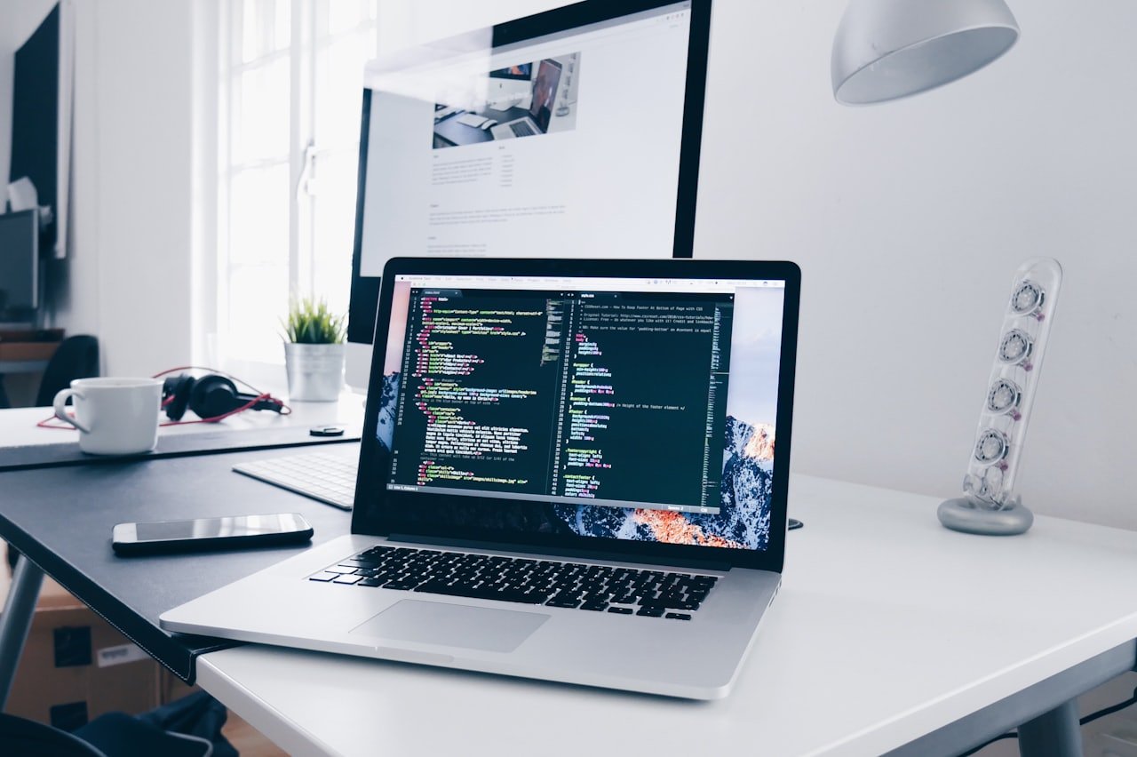 Developer reviewing website performance code on a laptop screen