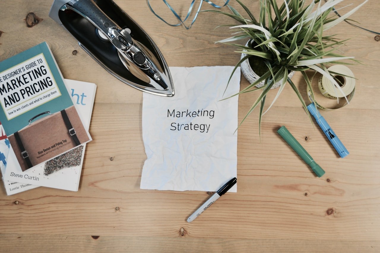 Smartphone showing social media advertising analytics with engagement growth curves